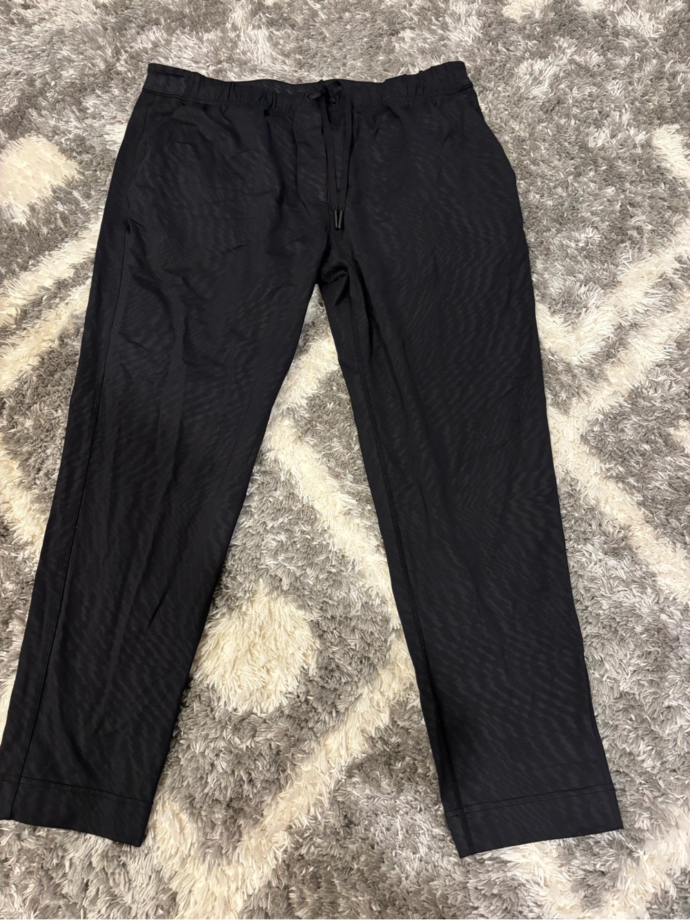 Women’s cropped Lululemon black with pattern joggers. Approximate size 12 or 14